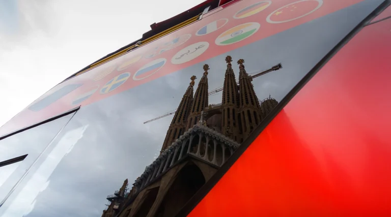 Sagrada Familia reflected in a Hop on Hop off bus window
