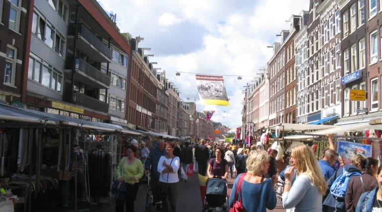 Stalls and shoppers on Albert Cuypmarkt in Amsterdam