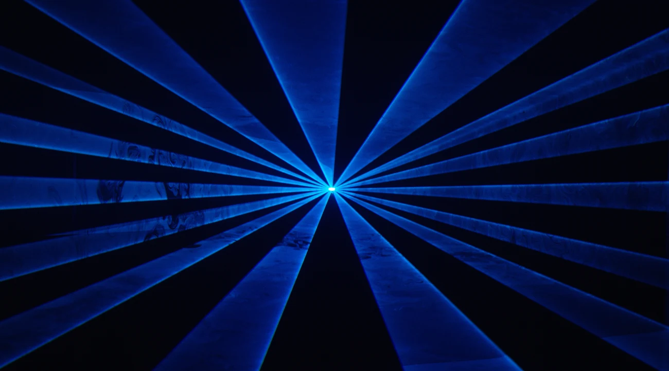 Blue laser beams radiating through a dark space, an illustrative image of immersive light effects