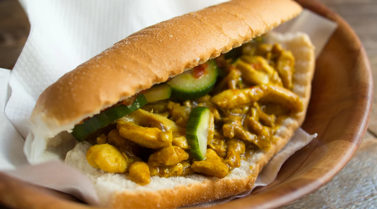 Surinamese chicken-curry broodje with cucumber, an illustrative sandwich photograph taken in The Hague
