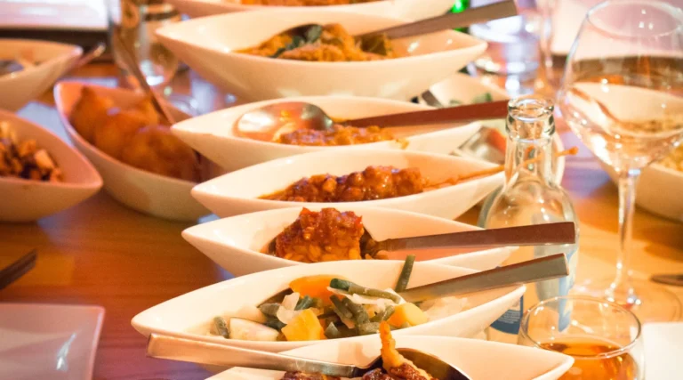 Indonesian rijsttafel dishes served in small bowls, an illustrative food photograph taken in The Hague