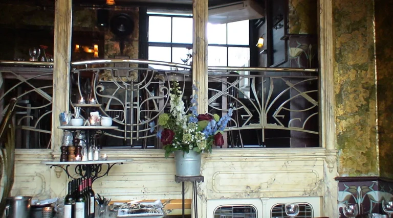 Art Nouveau mirrors, ironwork and bar details inside De Belhamel restaurant in Amsterdam