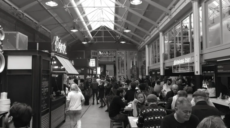 Diners and food stalls beneath the roof of Foodhallen in Amsterdam Oud-West, photographed in 2017