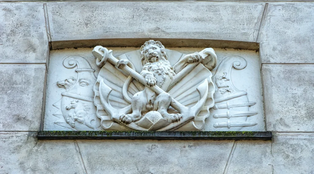 Maritime relief with a lion, anchors and nautical symbols on the National Maritime Museum facade in Amsterdam