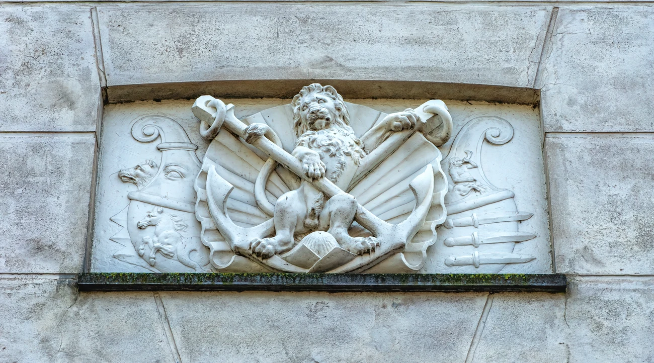 Maritime relief with a lion, anchors and nautical symbols on the National Maritime Museum facade in Amsterdam