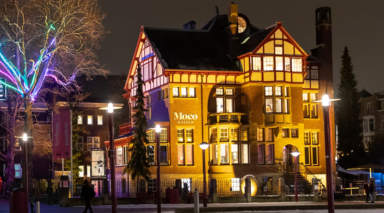 Exterior of Moco Museum Amsterdam with winter lights