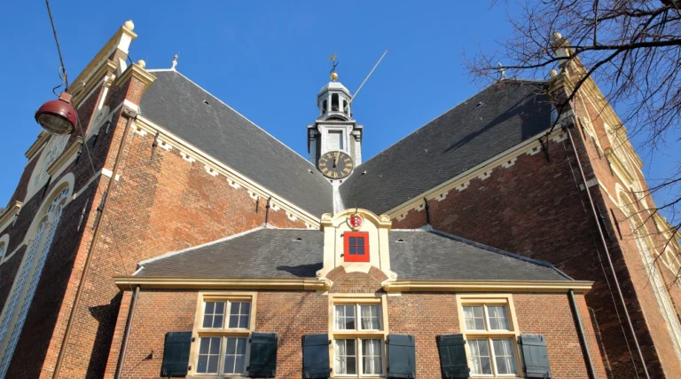 Brick gables and central clock turret of Noorderkerk on Noordermarkt in Amsterdam in daylight