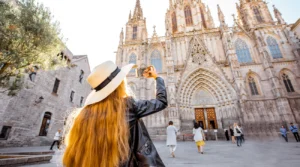 Woman taking a shot of Barcelona Cathedral